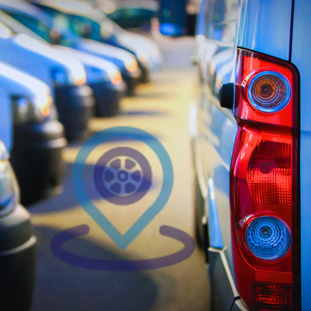 Close-up of a van’s rear light with a blurred row of fleet vans and a fleet tracking icon overlay