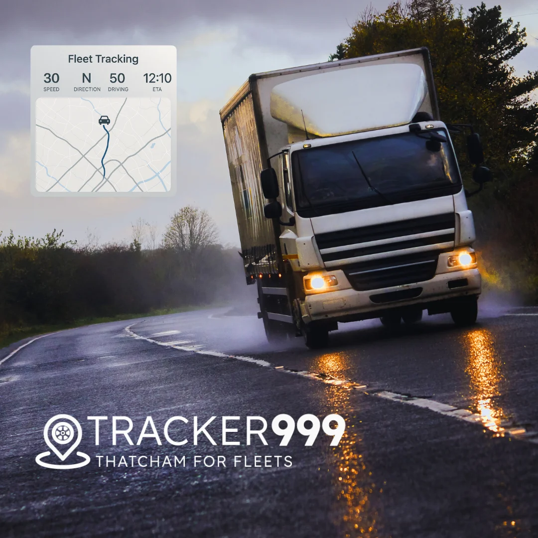 HGV driving on wet road with fleet tracking overlay and Tracker999 branding